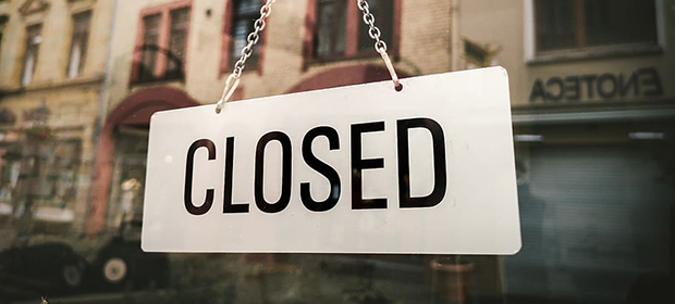 Closed sign on a restaurant door