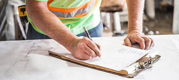 Construction professional completing paperwork